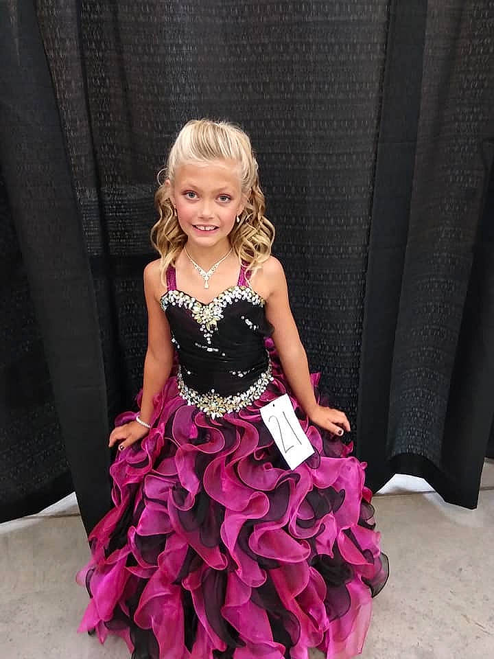 Keaton is registered to the contest to win money with this photo: a_line, bridal_party_dress, child, child_model, clothing, cocktail_dress, dress, event, formal_wear, gown, haute_couture, joy, magenta, person, pink, ruffle, satin