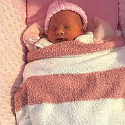 Ruby joined the competition — help win amazing prizes! newborn, baby, sleeping, blanket, pink, hat, cushion, soft, cozy, infant, bed, wrapped, cute, child, portrait, resting, warm, comfortable, indoors, peaceful