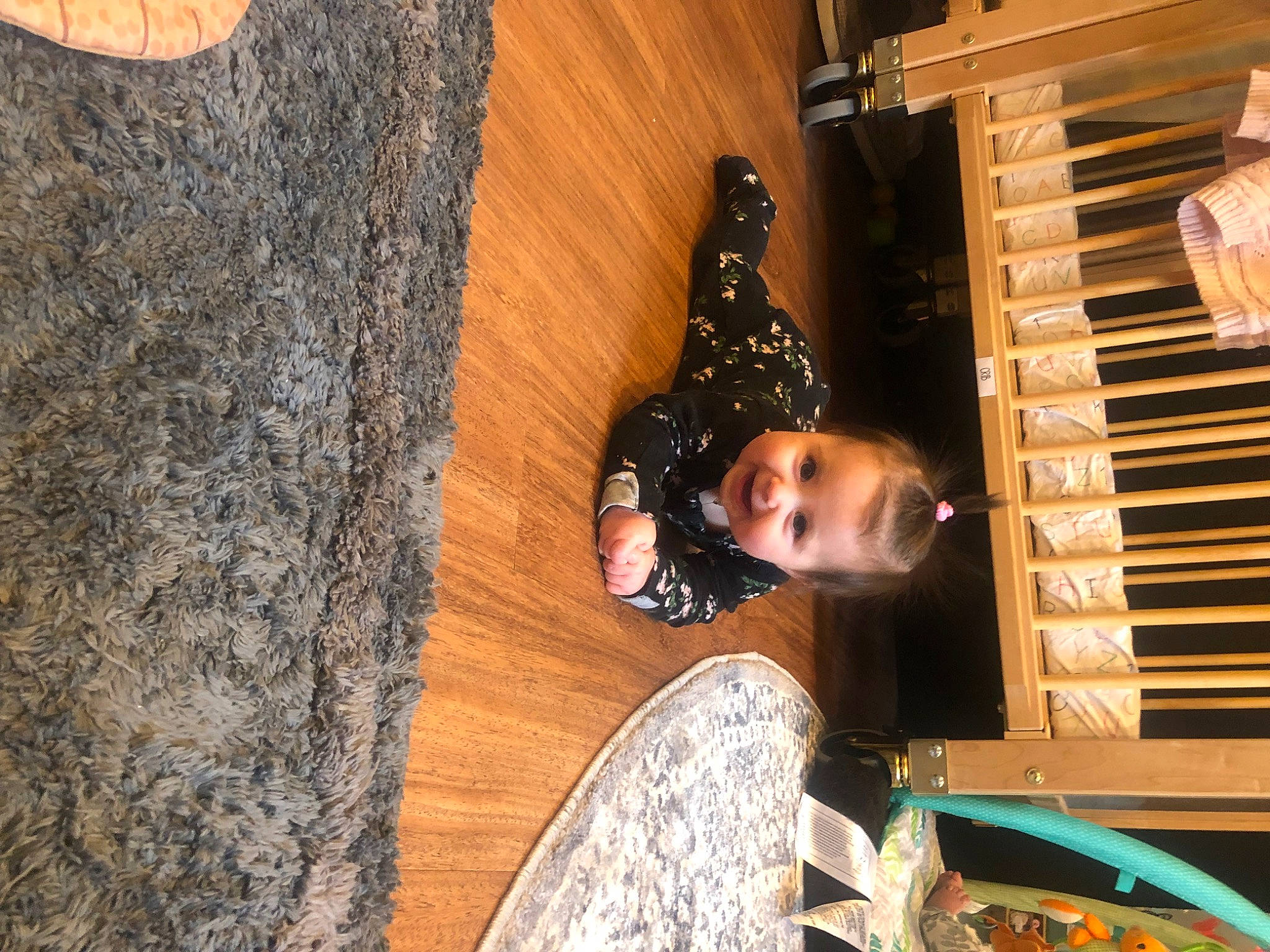 Bexley is registered to the contest to win money with this photo: child, flooring, fun, happy, hardwood, leisure, pattern, person, room, sunglasses, toddler, tradition, tree, trunk, wood, wood_stain