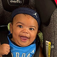 Kiegan is registered to the contest to win money with this photo: baby, blue_jersey, car_seat, child, closeup, clothing, cute, expression, face, happy, headband, headwear, indoors, infant, joyful, person, portrait, seatbelt, smiling, young_child