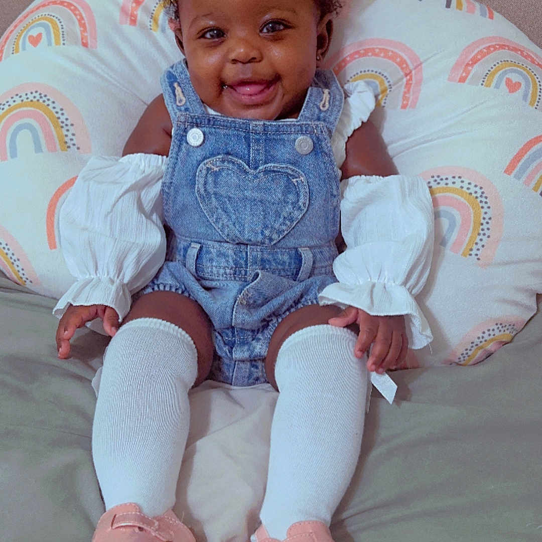 Madisyn joined the competition — help win amazing prizes! baby, clothing, couch, cushion, face, footwear, furniture, hat, head, homedecor, hosiery, jeans, pants, person, photography, portrait, sandal, shoe, sitting, sock