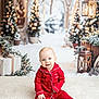 baby, child, red_pajamas, smiling, sitting, white_rug, christmas_trees, lanterns, holiday, winter, snow, decorations, presents, festive, indoors, cute, portrait, happy, bright, seasonal