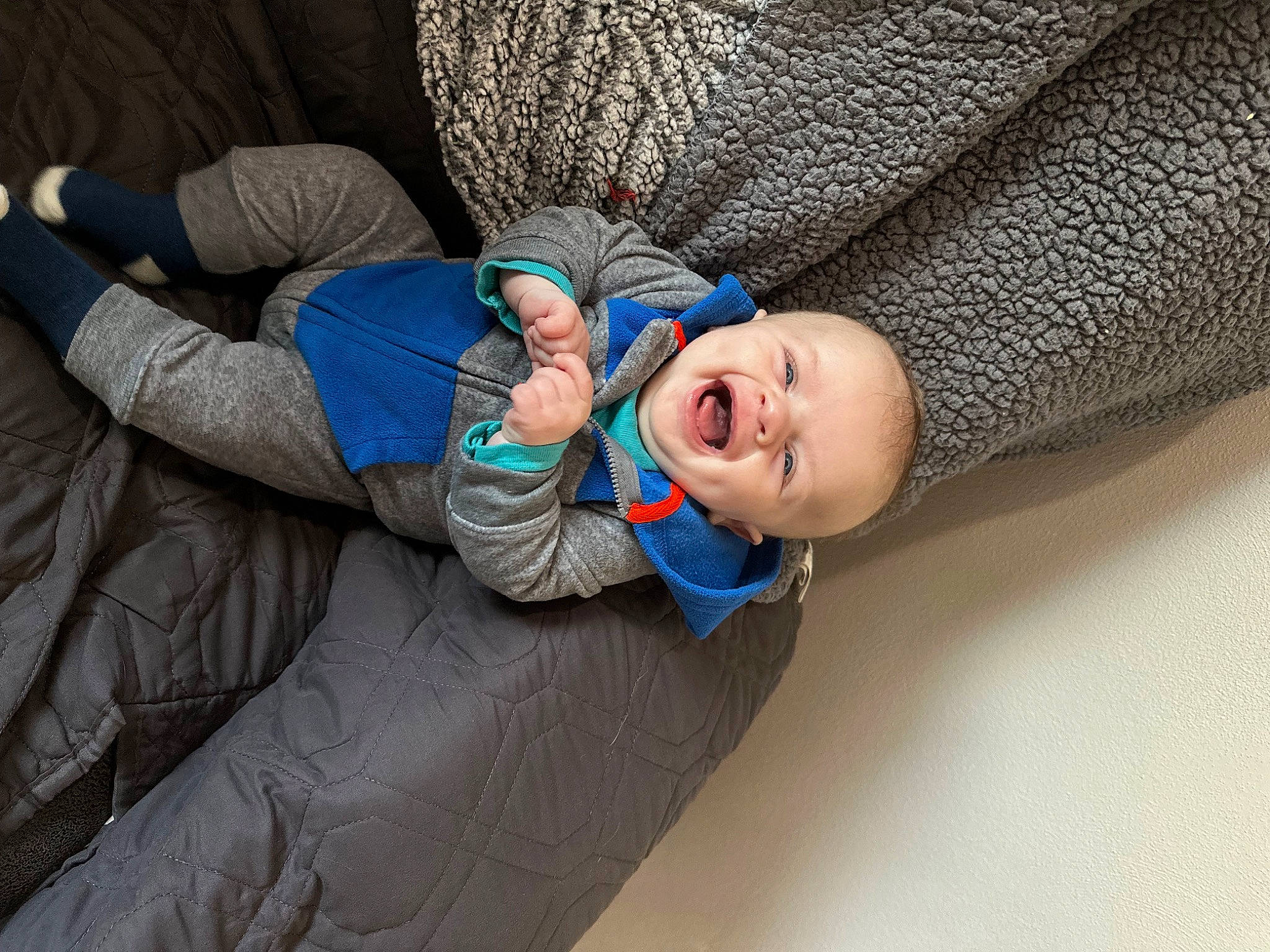 Jax joined the competition — help win amazing prizes! arm, baby, baby_products, baby_toddler_clothing, child, comfort, electric_blue, finger, fun, hand, happy, human_leg, linens, outerwear, person, sitting, sleeve, smile, textile, toddler