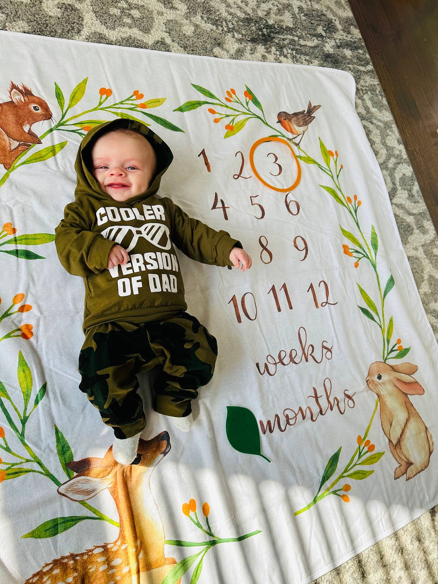 Jax is registered to the contest to win money with this photo: adaptation, baby_toddler_clothing, child, font, grass, green, handwriting, happy, hat, organism, pattern, people_in_nature, person, plant, product, shorts, sleeve, sun_hat, t_shirt, textile