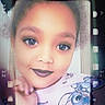 child, face, portrait, smile, hand, cartoon_clothing, curly_hair, indoor, young, cute, playful, film_strip_effect, nostalgic, vintage, eyeshadow, lipstick, person, fashion, expression, closeup