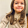 Aura joined the competition — help win amazing prizes! beige_sweater, brown_hair, casual_clothing, child, closeup, curly_hair, cute, eyebrows, face, happy, indoor, light_background, long_hair, natural_expression, person, portrait, smile, standing, warm_lighting, young