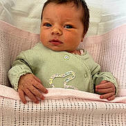 Bonnie is registered to the contest to win money with this photo: baby, bed, blanket, cozy, crib, cute, eyes, face, green_clothing, hand, indoors, infant, newborn, pink, portrait, resting, sleepwear, small_hands, soft, young_child