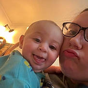 Corbin-James joined the competition — help win amazing prizes! baby, person, glasses, indoor, smile, tongue, face, closeup, child, happy, light, wall, lamp, sweatshirt, pattern, head, human, cute, affection, family
