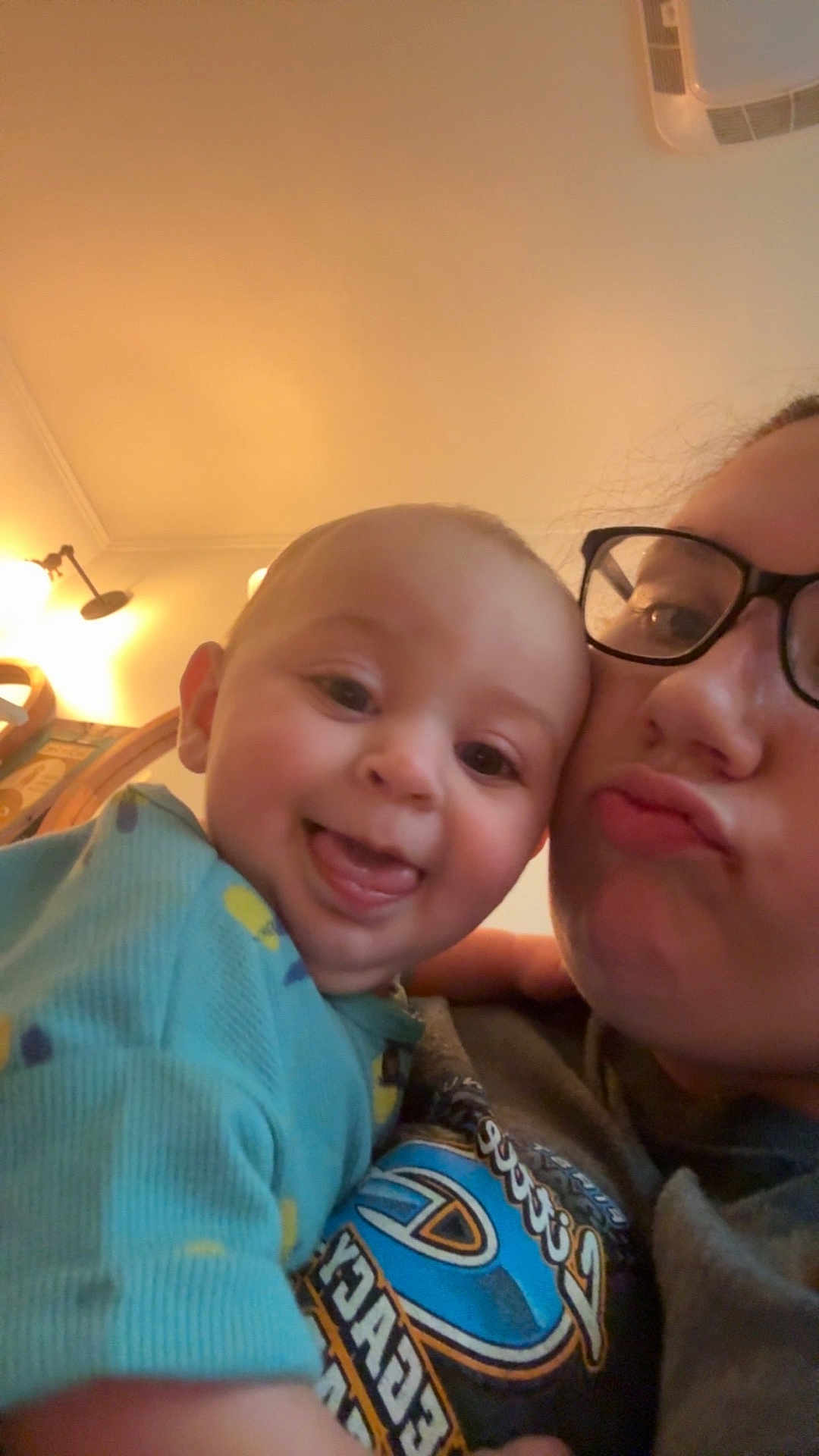 Corbin-James joined the competition — help win amazing prizes! baby, person, glasses, indoor, smile, tongue, face, closeup, child, happy, light, wall, lamp, sweatshirt, pattern, head, human, cute, affection, family
