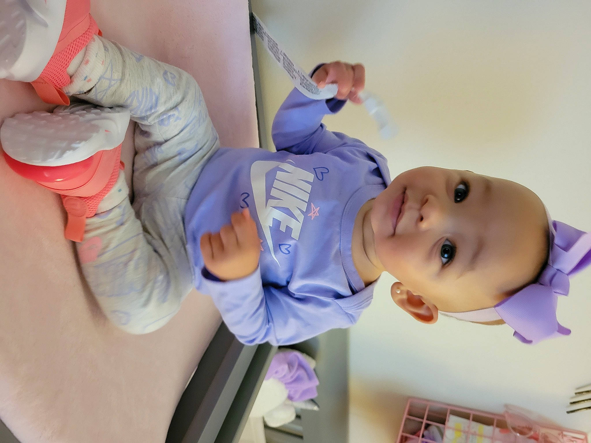 Demi is registered to the contest to win money with this photo: arm, baby, baby_toddler_clothing, child, comfort, elbow, finger, fun, gesture, happy, hat, human_leg, knee, leisure, mouth, person, room, skin, smile, thigh
