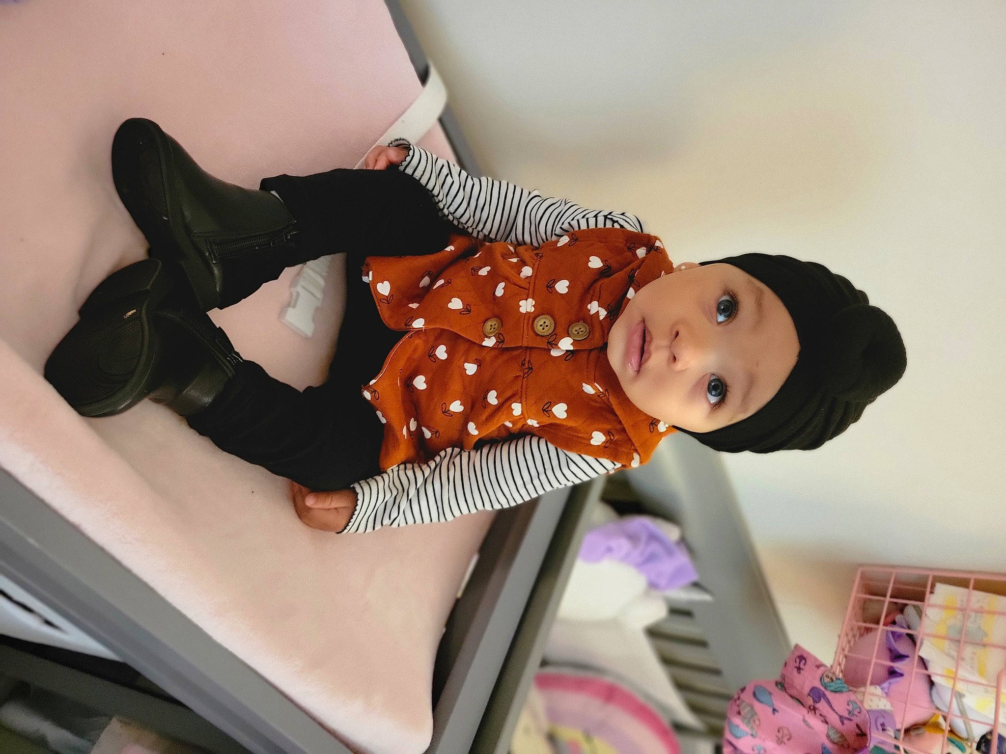 Demi joined the competition — help win amazing prizes! baby, baby_toddler_clothing, child, comfort, elbow, fashion_accessory, fashion_design, happy, headwear, human_leg, joint, knee, leg, pattern, person, pink, sitting, sleeve, smile, textile