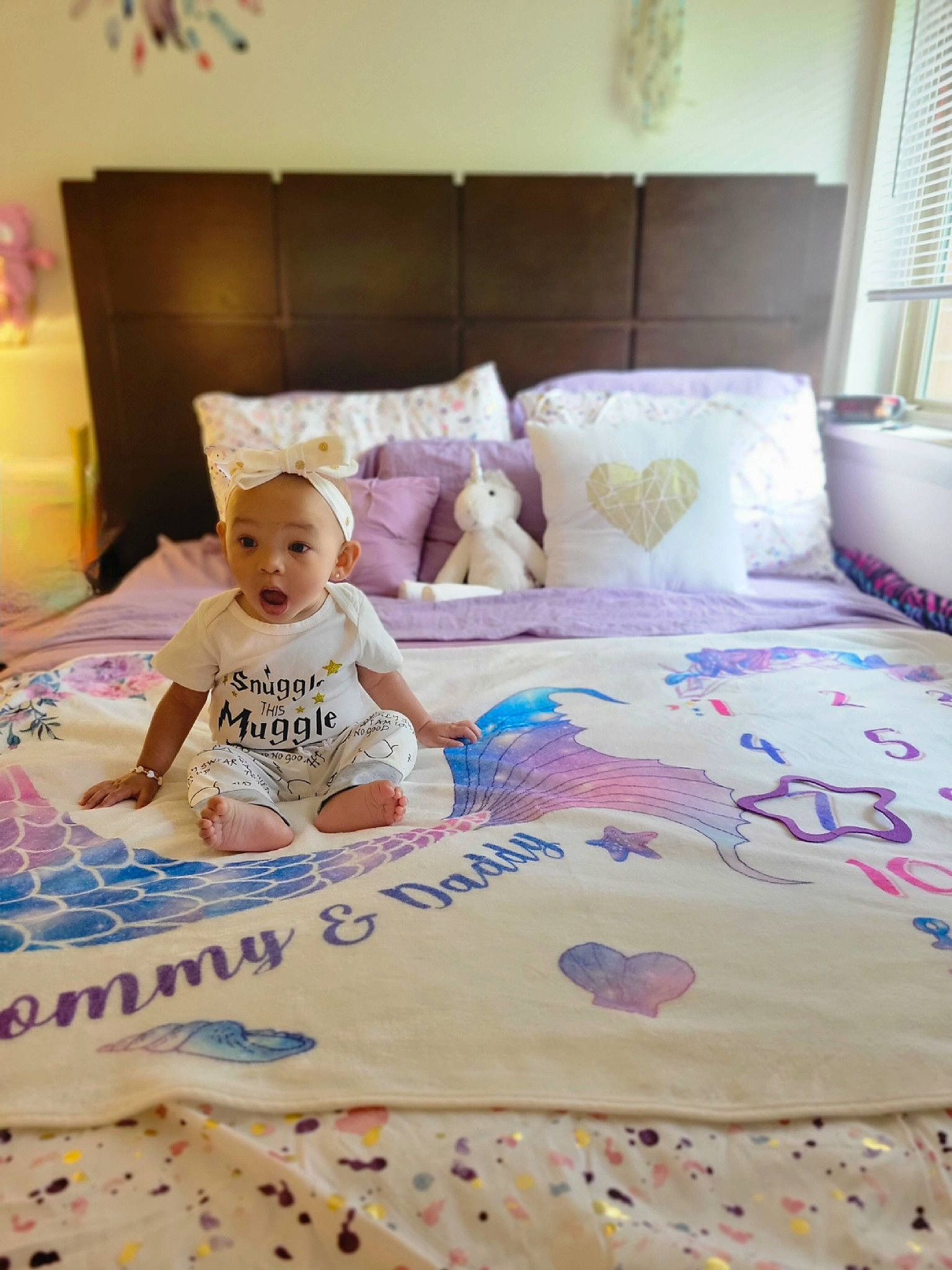 Demi joined the competition — help win amazing prizes! baby, baby_toddler_clothing, bed, bed_sheet, bedding, bedroom, comfort, floor, flooring, happy, lamp, linens, pattern, person, pillow, purple, room, surprise, t_shirt, textile