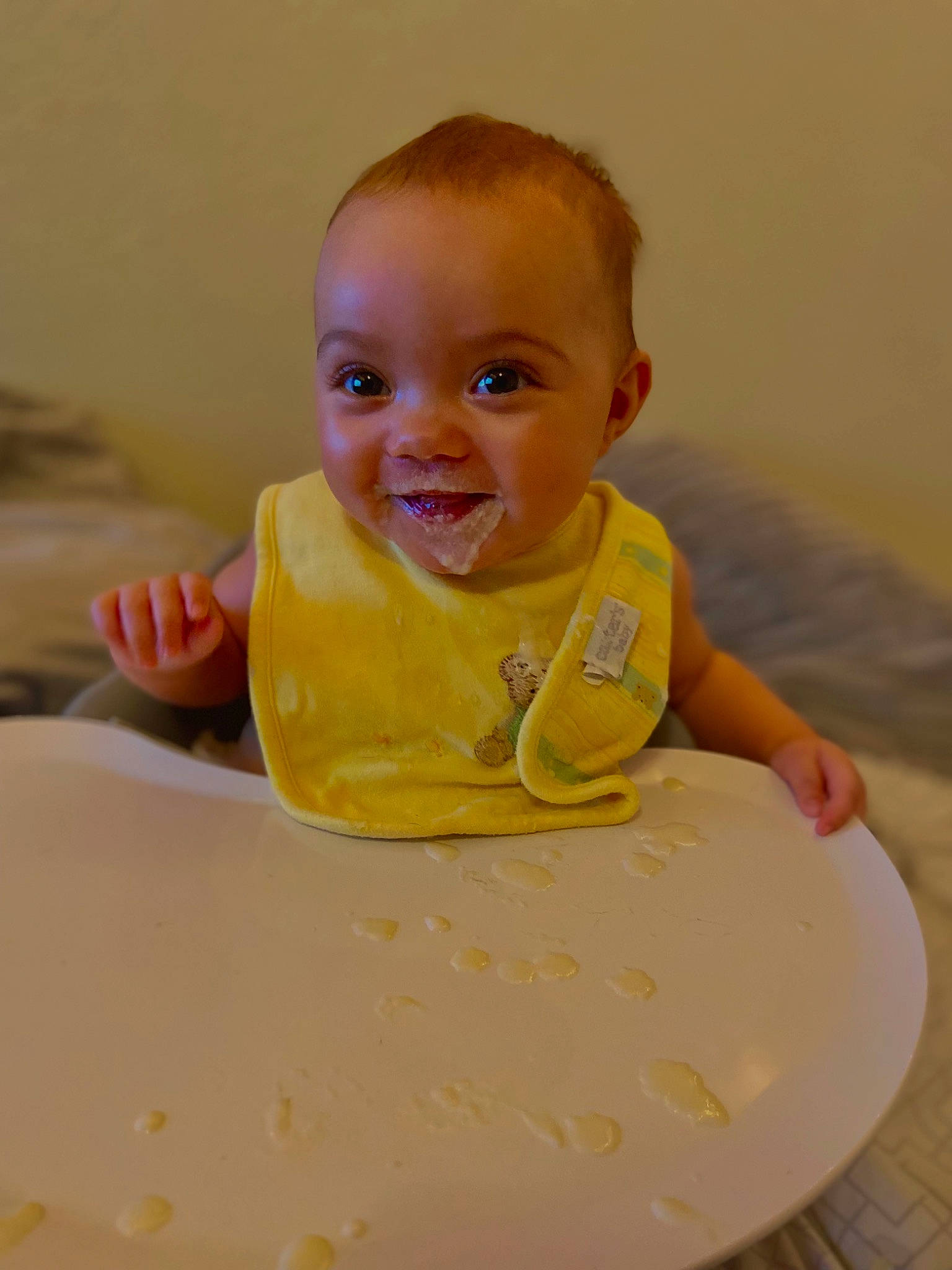 Elianna joined the competition — help win amazing prizes! baby, baby_food, baby_laughing, baby_products, baby_toddler_clothing, bathing, bib, cheek, child, fun, happy, iris, joy, person, room, sitting, skin, sleeve, smile, t_shirt