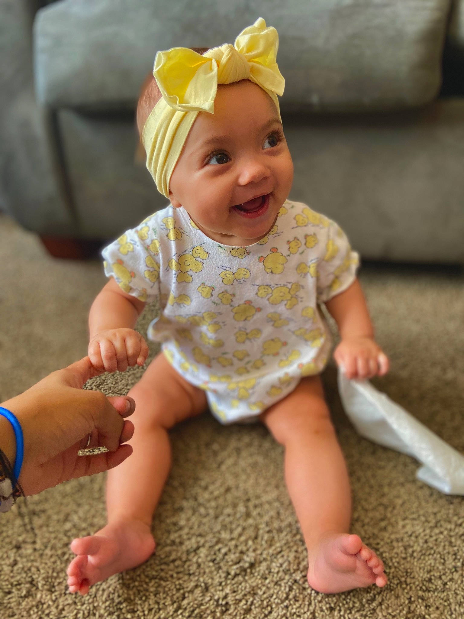 Elianna is registered to the contest to win money with this photo: baby, baby_toddler_clothing, barefoot, child, fashion_accessory, finger, foot, fun, grass, hair_accessory, happy, headwear, human_leg, joy, people_in_nature, person, photograph, pink, sitting, skin