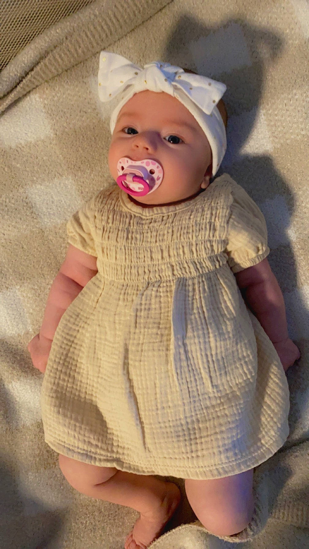 Kaliah joined the competition — help win amazing prizes! baby, baby_toddler_clothing, blond, cap, cheek, chin, day_dress, dress, eye, eyelash, face, headgear, headwear, iris, lip, one_piece_garment, person, pink, skin, sleeve