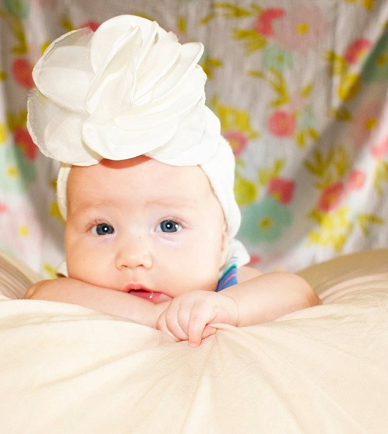 Sloane joined the competition — help win amazing prizes! baby, baby_toddler_clothing, cheek, child, fashion_accessory, hair_accessory, headband, headgear, headpiece, headwear, person, photograph, photography, pink, portrait_photography, product, room, skin, toddler, yellow