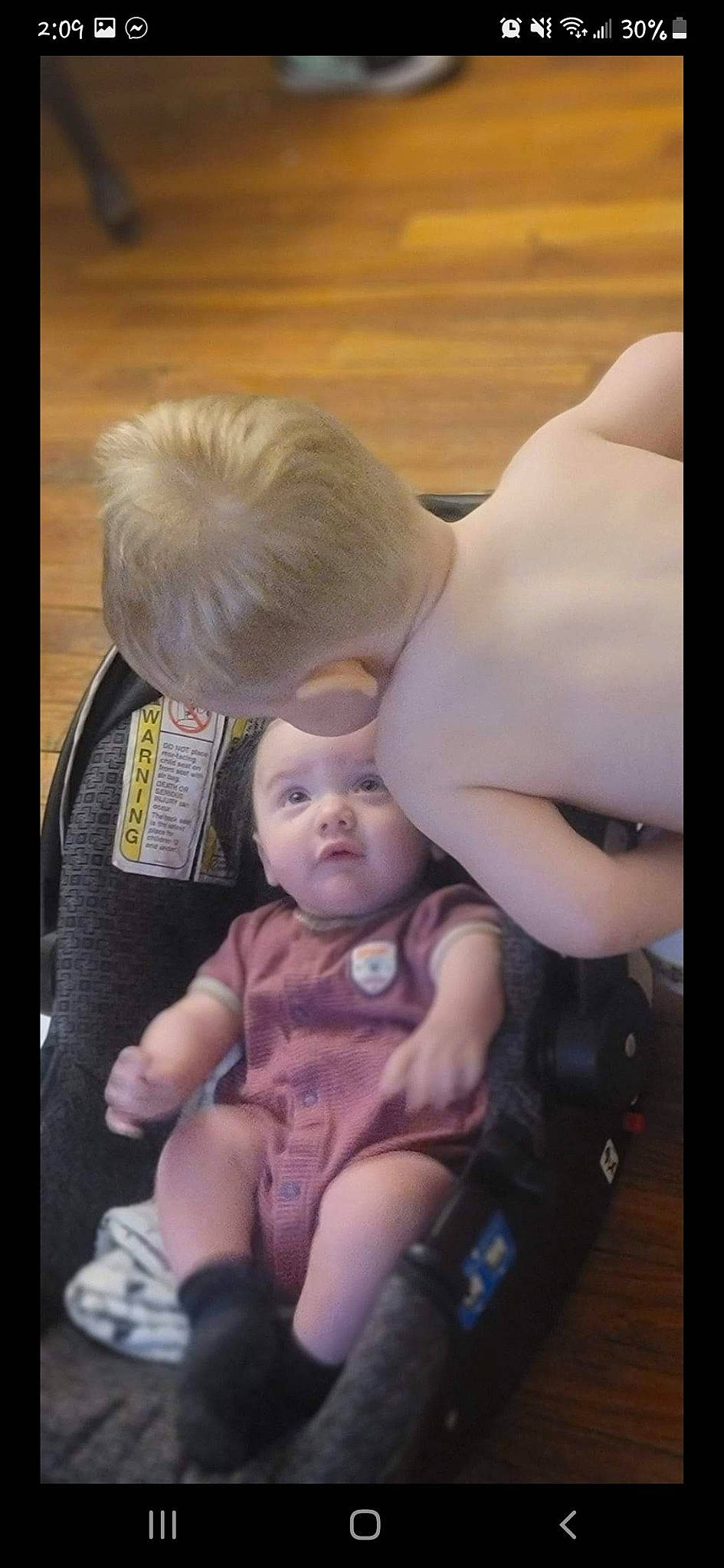 Zander joined the competition — help win amazing prizes! baby, baby_carriage, baby_products, baby_toddler_clothing, chest, child, comfort, fun, gesture, happy, hug, lap, person, sitting, sock, toddler