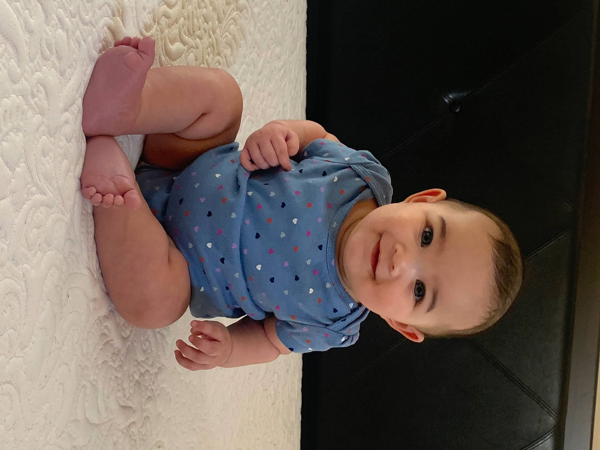 Kamari joined the competition — help win amazing prizes! baby, baby_products, baby_toddler_clothing, child, comfort, elbow, finger, fun, gesture, happy, human_body, human_leg, joy, leg, pattern, person, sitting, skin, sleeve, smile