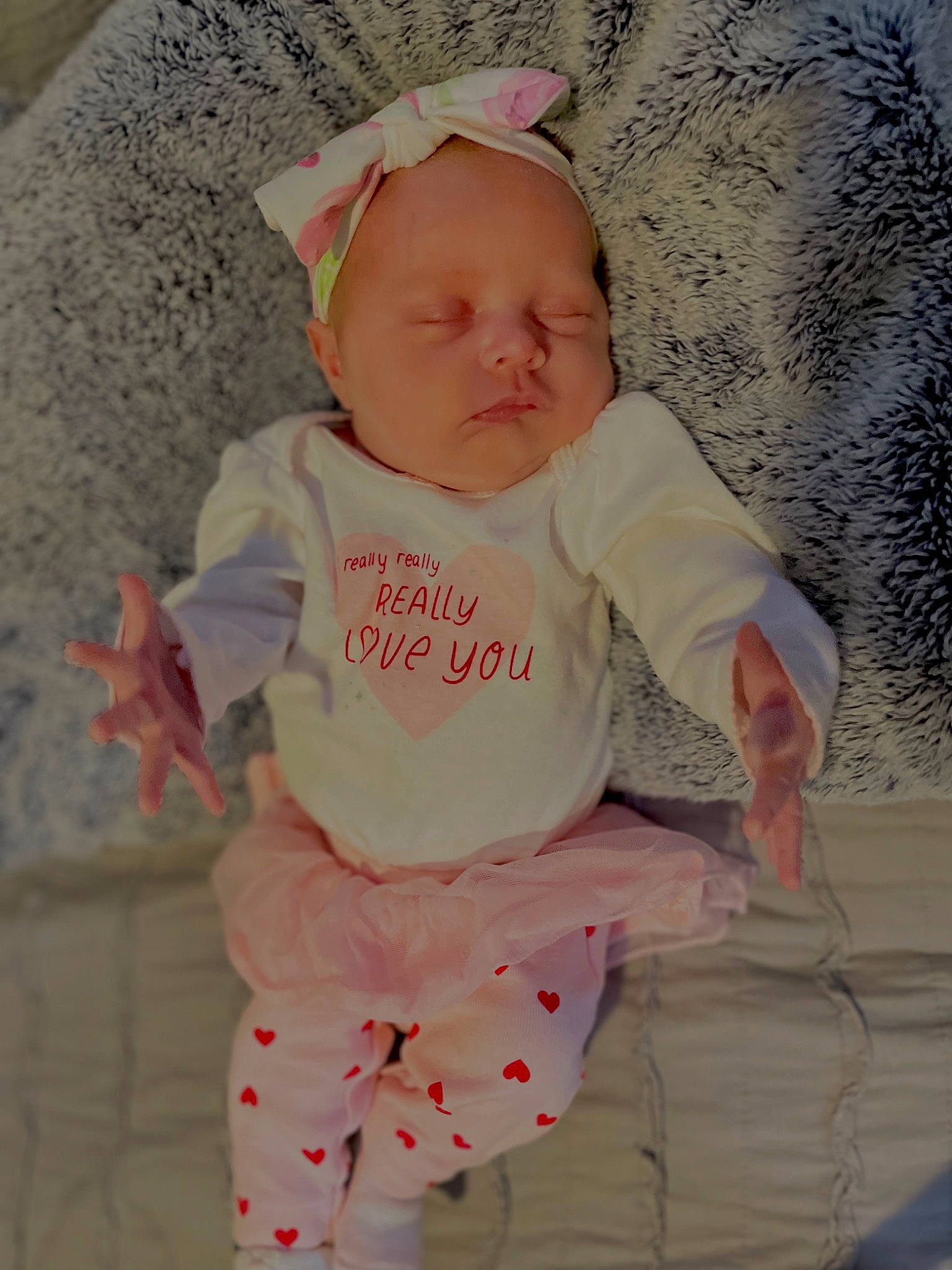 Cora joined the competition — help win amazing prizes! baby, baby_products, baby_toddler_clothing, cheek, child, comfort, face, happy, head, linens, pattern, peach, person, pink, sitting, skin, sleeve, sock, t_shirt, textile