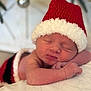 Julia joined the competition — help win amazing prizes! newborn, baby, sleeping, santa_hat, christmas, holiday, infant, blanket, soft_focus, portrait, hands, face, closed_eyes, cuteness, cozy, red_hat, bauble, decor, bedding, cute