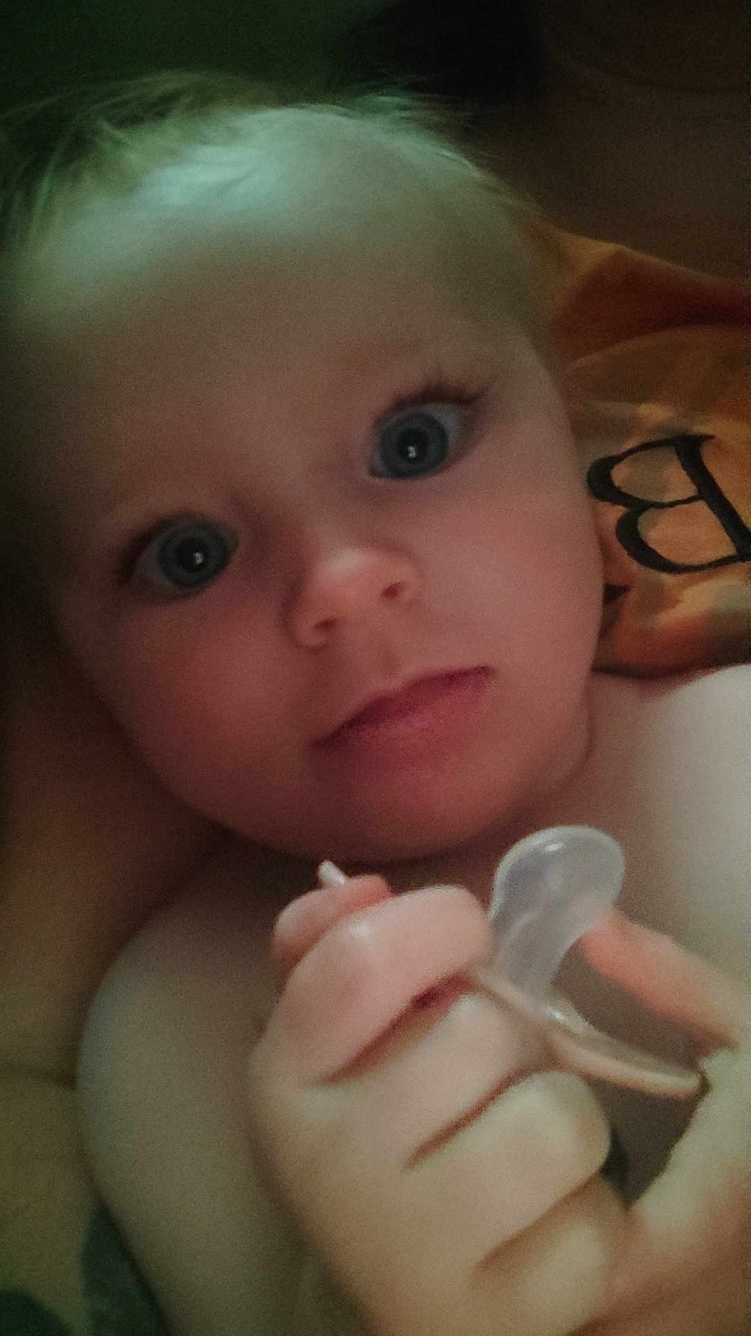 Myanna a rejoint le concours — aidez-le/la à gagner de superbes lots ! baby, infant, face, blue_eyes, hand, pacifier, blanket, closeup, skin, cute, child, portrait, expression, soft_light, indoors, young, holding, looking, person, warm