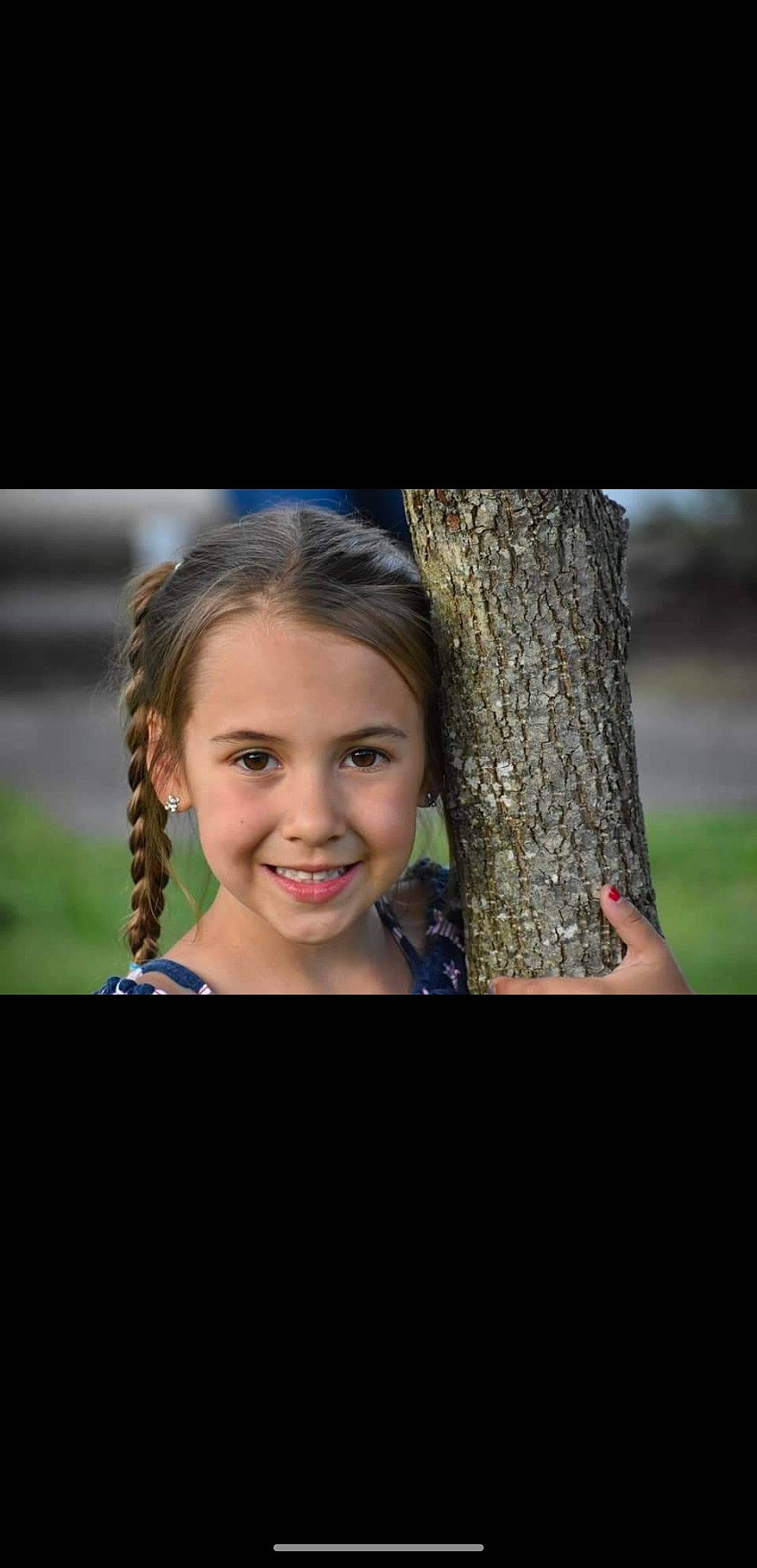 Emily joined the competition — help win amazing prizes! brown_hair, child, electric_blue, eyelash, flash_photography, fun, grass, happy, human_body, iris, jewellery, joy, long_hair, people_in_nature, person, shoulder, sitting, smile, standing, tree