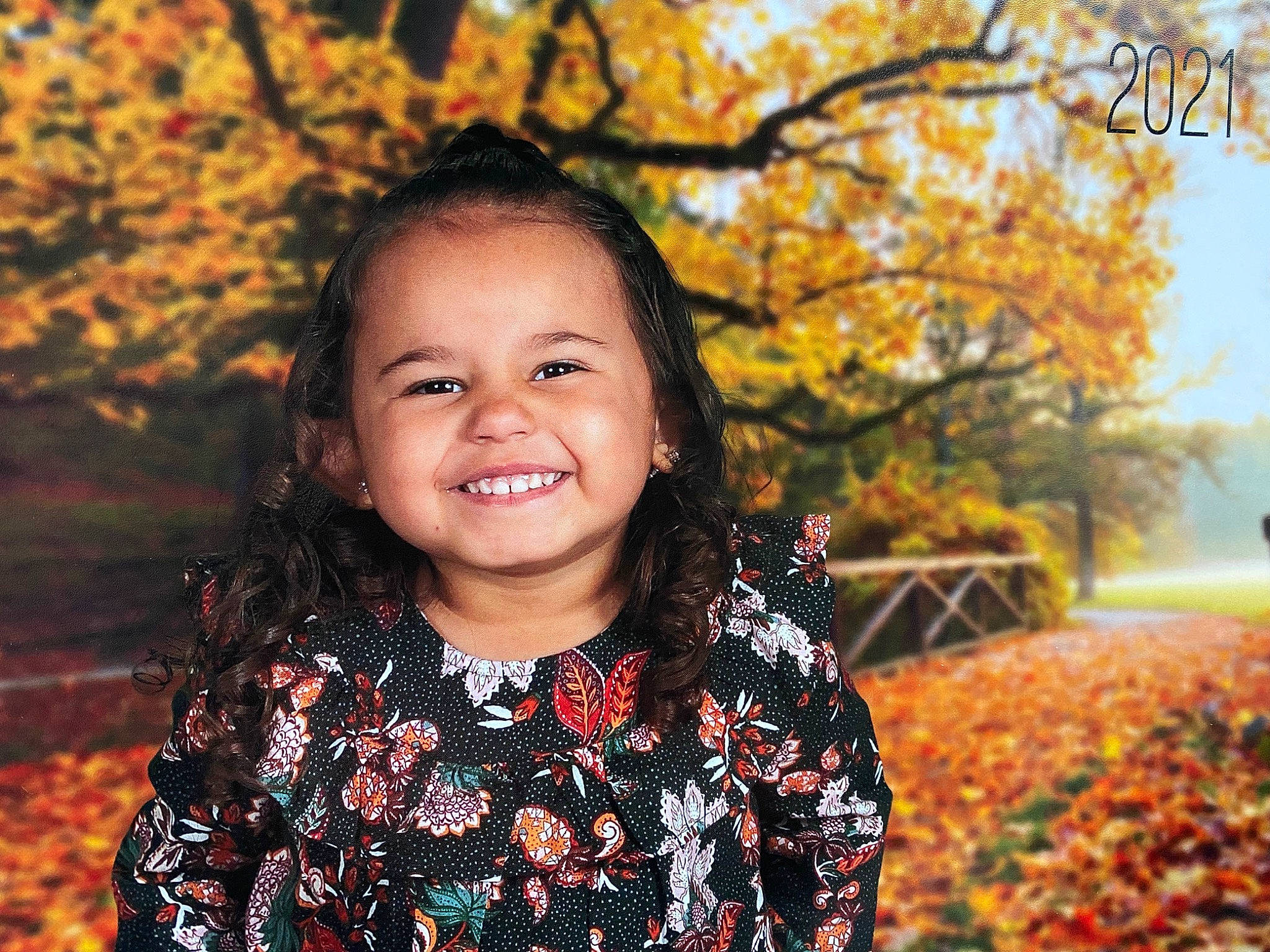 Aviana is registered to the contest to win money with this photo: branch, eye, facial_expression, flash_photography, grass, hair, happy, head, iris, joy, leaf, lip, orange, organ, outerwear, people_in_nature, person, photograph, plant, smile