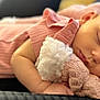 baby, sleeping, pink_outfit, blanket, knitted, cute, peaceful, infant, soft, cozy, child, resting, portrait, skin, hand, face, newborn, closeup, indoors, toddler