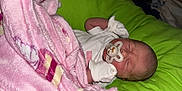 Pippa Elsie is registered to the contest to win money with this photo: newborn, baby, sleeping, pacifier, blanket, mittens, infant, resting, cozy, soft, pink, white, green, face, head, peaceful, cute, child, indoors, portrait