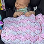 Pippa Elsie is registered to the contest to win money with this photo: baby, newborn, sleeping, blanket, crocheted, pink, white, car_seat, infant, child, peaceful, hands, feet, black, warning_label, seatbelt, soft, cozy, portrait, indoor