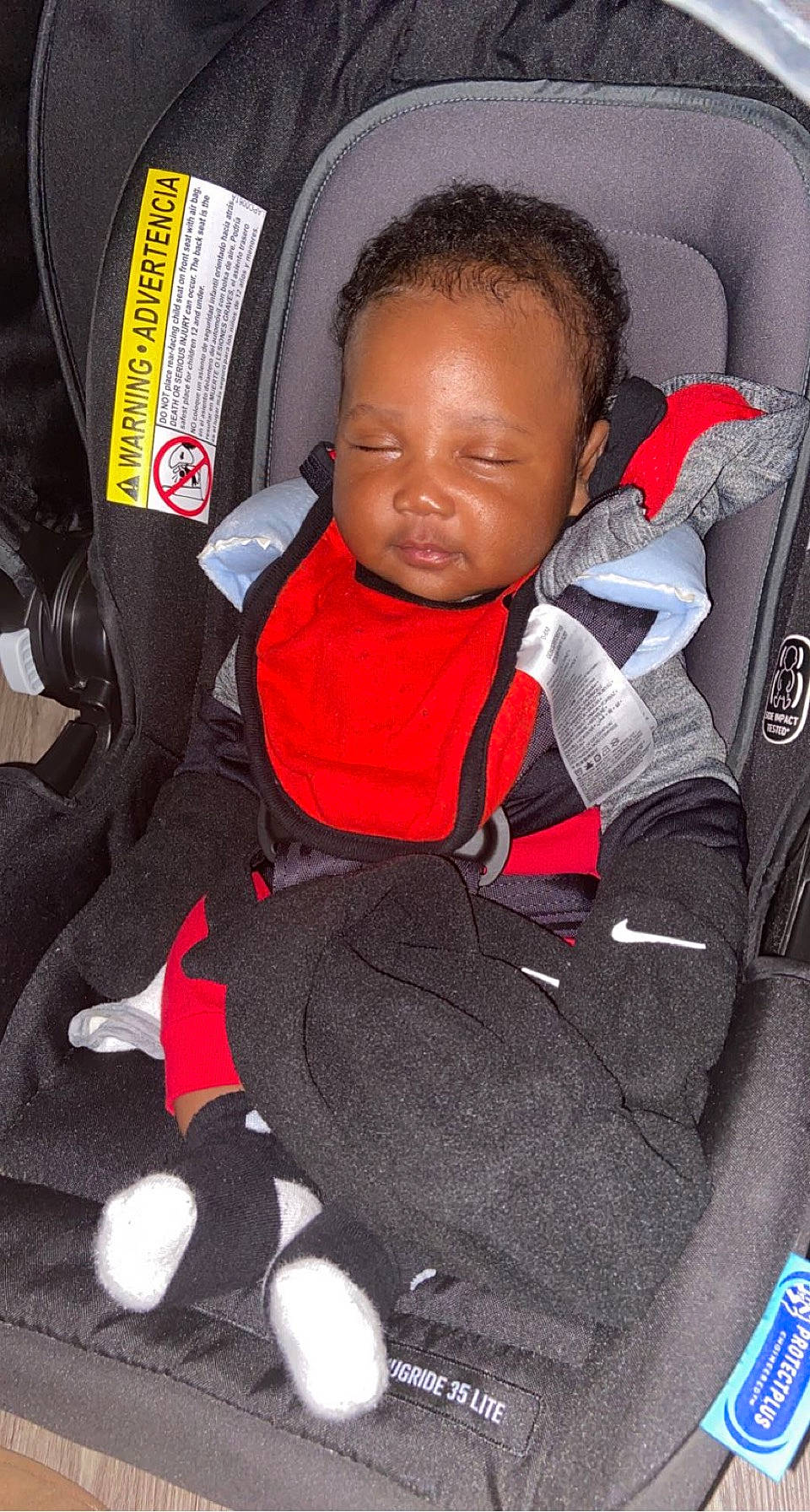 Erick is registered to the contest to win money with this photo: baby, baby_carriage, baby_in_car_seat, baby_products, baby_safety, baby_toddler_clothing, car_seat, carmine, child, comfort, person, product, red, seat_belt, service, stuffed_toy, toddler, toy