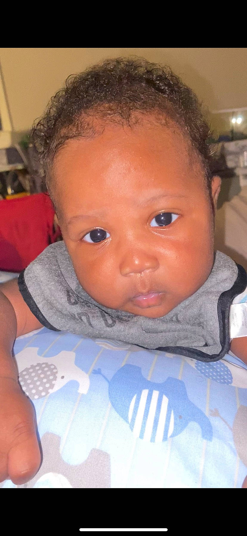 Erick is registered to the contest to win money with this photo: baby, baby_products, baby_toddler_clothing, black_hair, cheek, child, chin, comfort, eyebrow, eyelash, forehead, hairstyle, iris, linens, lip, organ, person, skin, toddler