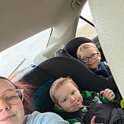 Edward joined the competition — help win amazing prizes! child, children, adult, glasses, car, car_seat, seatbelt, window, casual_clothing, smile, interior, family, portrait, safety, road_trip, happy, seat, vehicle, people, travel