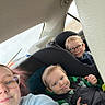 child, children, adult, glasses, car, car_seat, seatbelt, window, casual_clothing, smile, interior, family, portrait, safety, road_trip, happy, seat, vehicle, people, travel