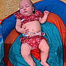 Galaxy Watts joined the competition — help win amazing prizes! baby, infant, swimsuit, pool_float, sleeping, child, water, summer, outdoor, cute, relaxing, skin, legs, arms, face, peaceful, colorful, red, blue, orange