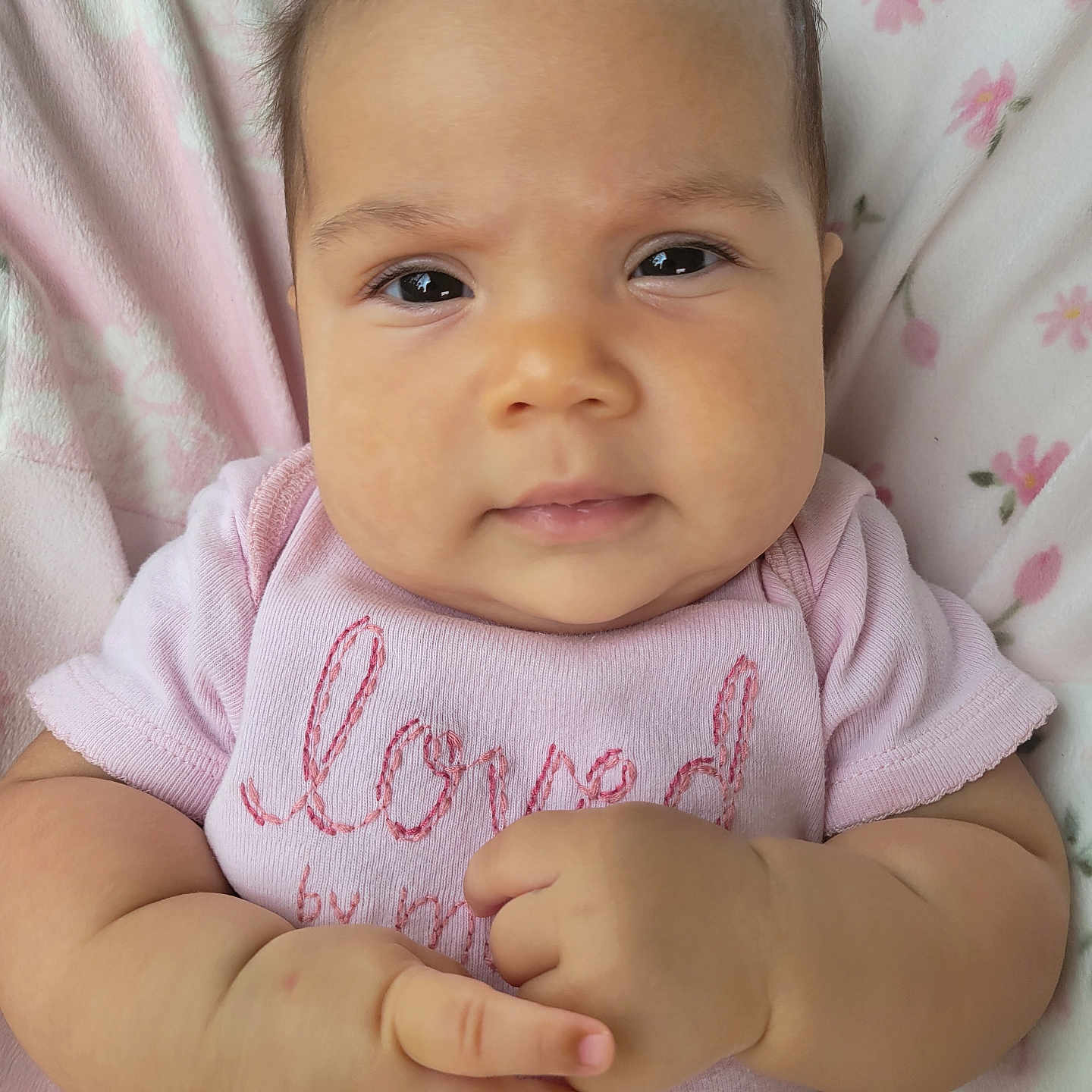 Nova joined the competition — help win amazing prizes! baby, bodypart, clothing, face, finger, frown, hand, happy, head, newborn, pants, person, photography, portrait, quilt, sad, sitting, smile, t_shirt, wrist