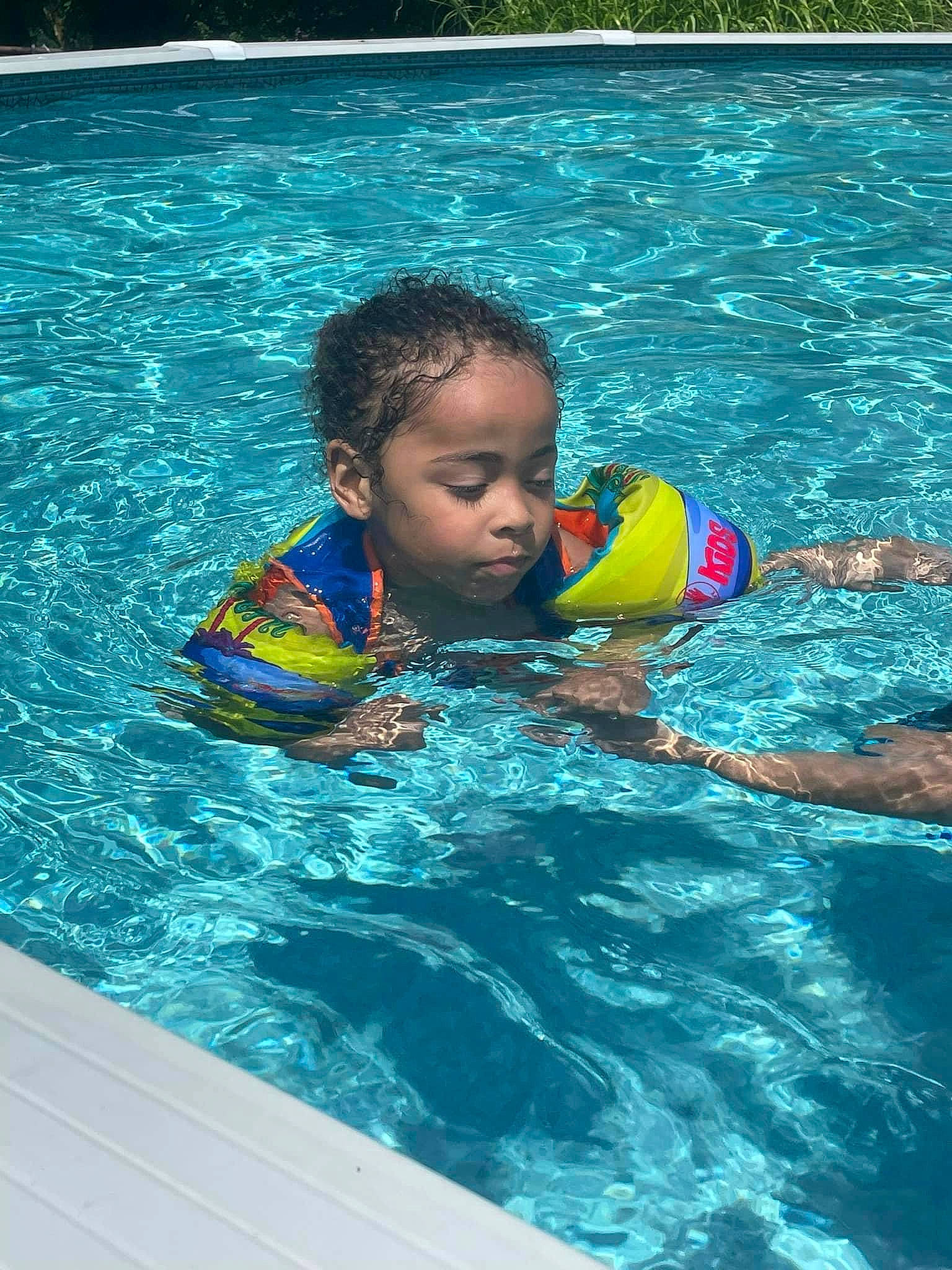 Kayden is registered to the contest to win money with this photo: aqua, azure, baby, bathing, child, fluid, fun, games, indoor_games_and_sports, leisure, leisure_centre, liquid, outdoor_recreation, person, personal_protective_equipment, play, recreation, sports, swimming_pool, toddler