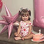 balloon, bench, birthday, bows, cake, celebration, child, cute, dress, girl, happy, indoor, number_one, party, pigtails, pink, portrait, smile, strawberry_pattern, toddler