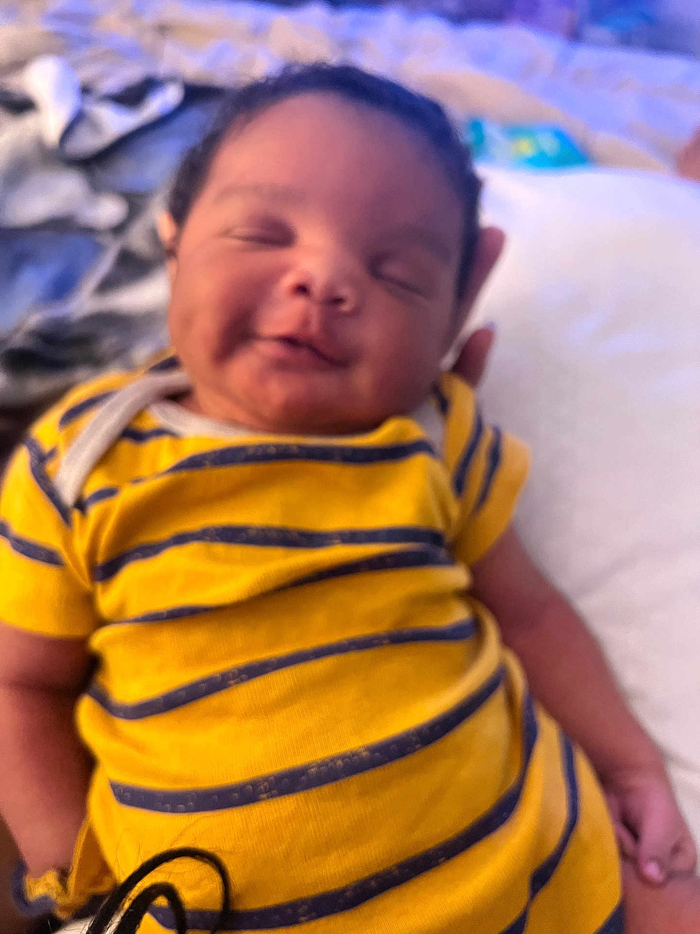 Joshua joined the competition — help win amazing prizes! baby, child, smiling, yellow_shirt, striped_clothing, portrait, infant, cute, resting, happy, person, face, hand, indoors, closeup, soft_focus, sleepy, young, toddler, content