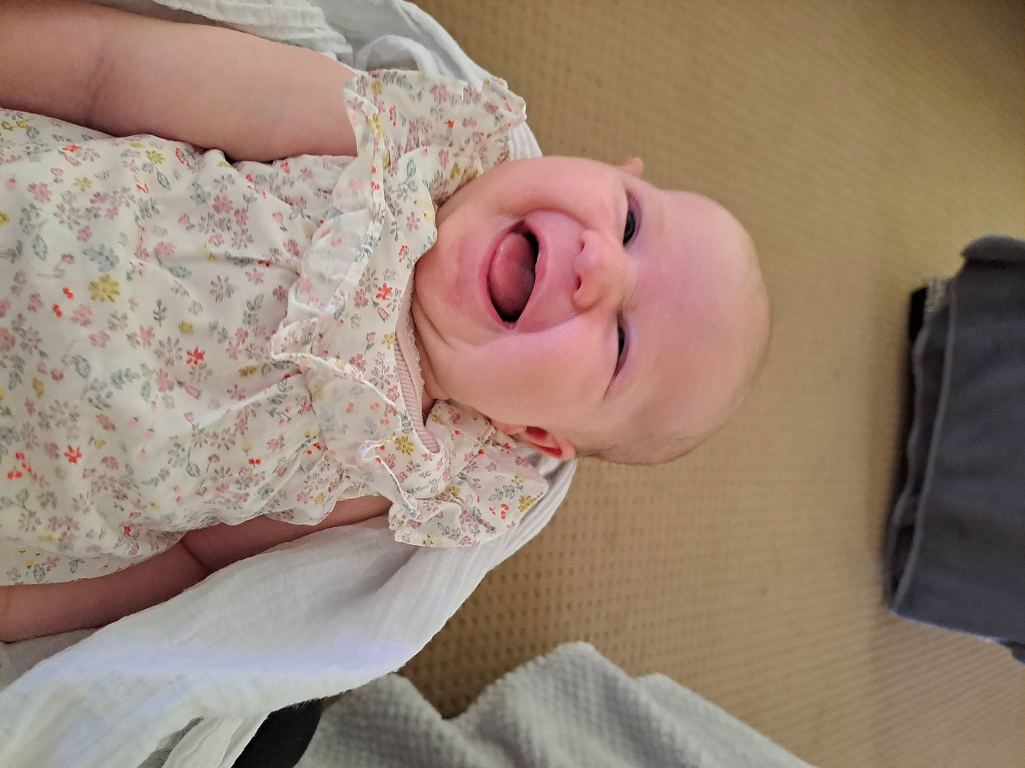 Imogen is registered to the contest to win money with this photo: arm, baby, baby_sleeping, baby_toddler_clothing, bag, child, comfort, eye, fashion_accessory, happy, hat, head, human_body, linens, luggage_and_bags, neck, pattern, person, sleeve, smile