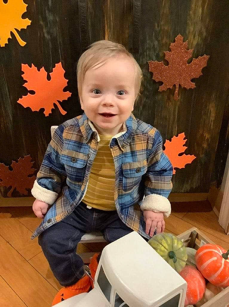 Mason joined the competition — help win amazing prizes! baby_toddler_clothing, child, flooring, fun, happy, human_body, joy, natural_foods, orange, organ, pattern, person, red, room, sitting, smile, standing, toddler, toy, tree