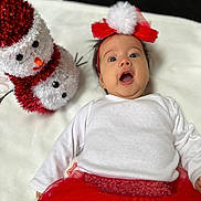 Hannah joined the competition — help win amazing prizes! baby, clothing, couch, dress, face, happy, hat, head, nature, newborn, outdoors, person, photography, plush, portrait, snow, snowman, toy, winter, yawning