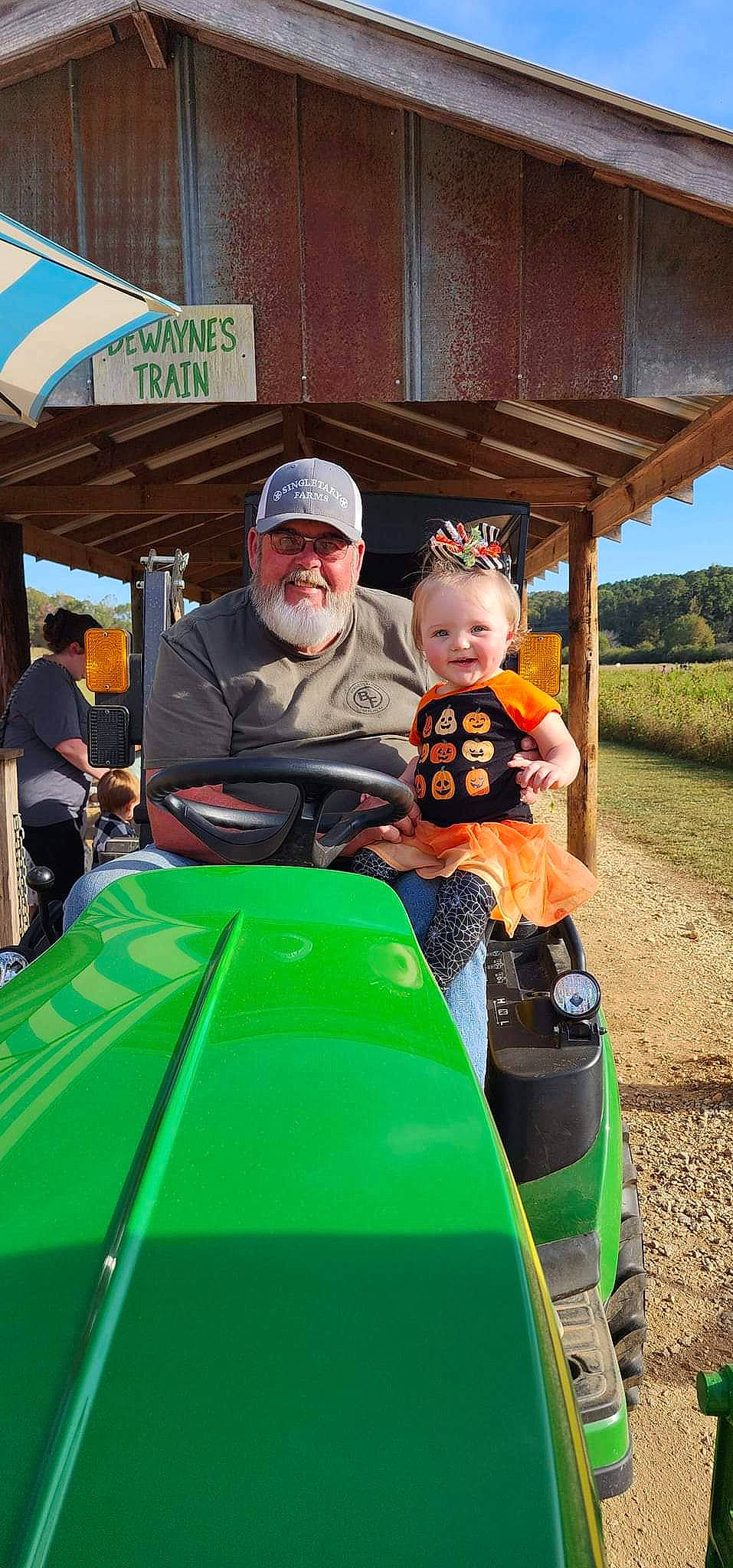 Alayna joined the competition — help win amazing prizes! automotive_design, automotive_exterior, automotive_tire, baseball_cap, fun, glasses, grass, hat, headwear, jacket, joy, leisure, motor_vehicle, person, plant, public_space, smile, t_shirt, tire, toddler