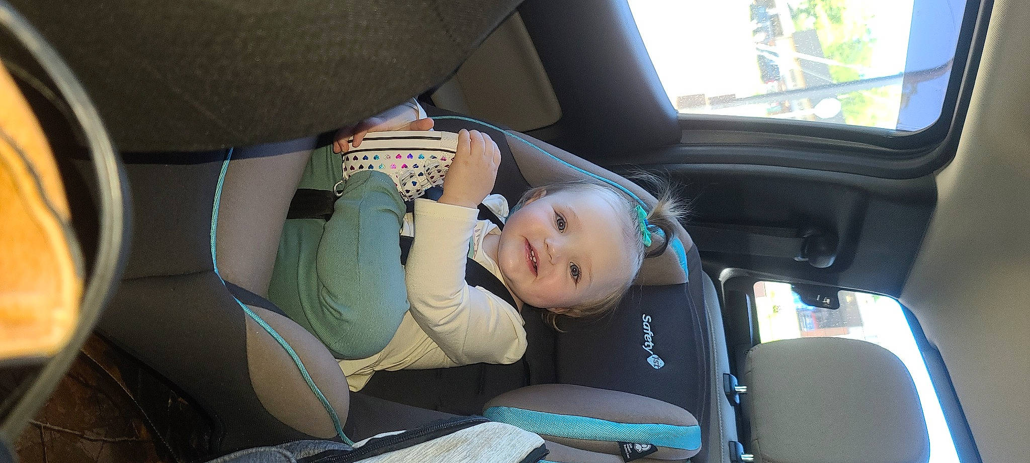 Alayna is registered to the contest to win money with this photo: auto_part, automotive_design, automotive_exterior, baby, car, car_seat, car_seat_cover, comfort, family_car, head_restraint, mode_of_transport, motor_vehicle, person, personal_luxury_car, seat_belt, steering_part, steering_wheel, toddler, vehicle, vehicle_door