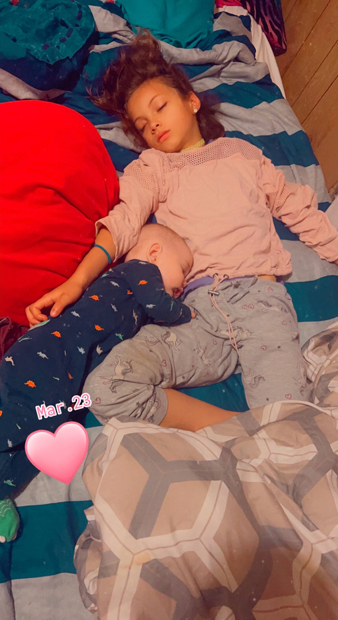 Hezekylee is registered to the contest to win money with this photo: abdomen, child, comfort, event, fun, happy, human_leg, knee, lap, leisure, linens, pattern, person, pink, sitting, sock, t_shirt, textile, thigh, toddler