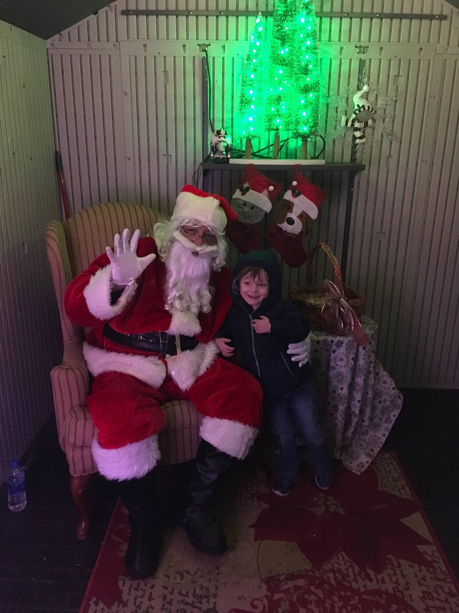 Gerald is registered to the contest to win money with this photo: christmas, christmas_eve, costume, event, fictional_character, holiday, joy, person, room, santa_claus