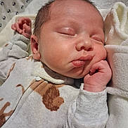 Wrangler joined the competition — help win amazing prizes! newborn, baby, sleeping, onesie, blanket, soft, cozy, infant, face, hand, peaceful, cute, portrait, closeup, resting, skin, fingertips, warm, indoors, child