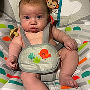 Wrangler joined the competition — help win amazing prizes! baby, infant, face, eyes, chubby_cheeks, bouncer_seat, seat_harness, pacifier, toy_monkey, patterned_fabric, legs, arms, mouth, skin, expression, indoor, closeup, cute, child, seat