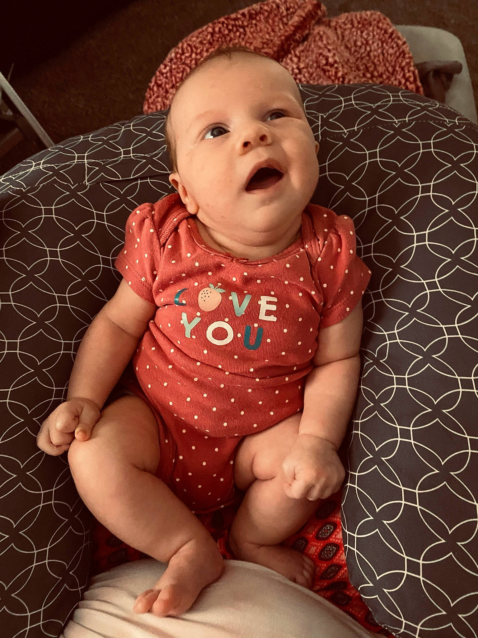 Laikyn is registered to the contest to win money with this photo: arm, baby, baby_toddler_clothing, cheek, comfort, dress, eye, head, human_body, iris, lip, mouth, neck, nose, organ, person, pink, skin, sleeve, textile