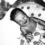 Adélassya participe au concours pour gagner de l'argent avec cette photo : baby, blanket, child, closeup, curly_hair, cute, expression, face, hand, happy, indoor, infant, newborn, portrait, resting, skin, sleeping, smiling, soft, wrapped